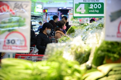 Chính phủ đặt quyết tâm đề ra các mục tiêu năm nay tăng trưởng GDP đạt 6,5%, lạm phát ở mức khoảng 4,5%. Ảnh minh hoạ: Quốc Tuấn