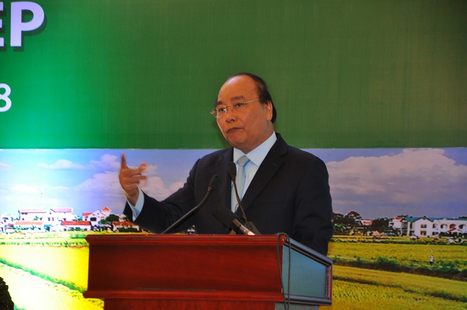 Thủ tướng Nguyễn Xuân Phúc phát biểu tại Hội nghị thúc đẩy đầu tư vào nông nghiệp tại Đà Lạt. Ảnh Công Minh
