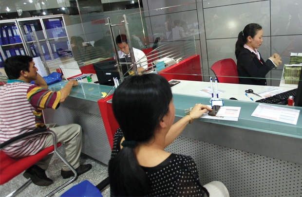 Việc chuyển đổi từ hộ kinh doanh lên doanh nghiệp có thể giúp dễ tiếp cận vốn ngân hàng hơn Ảnh: Quý Hòa