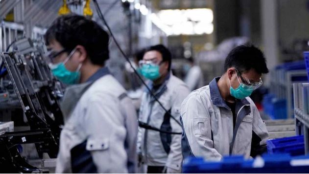  Một dây chuyền sản xuất ghế ngồi ô tô ở Thượng Hải. Ảnh: Reuters. 