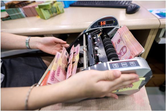  Nhiều yếu tố hỗ trợ ngành ngân hàng trong năm nay. Ảnh: Trọng Hiếu. 