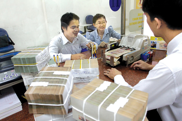 Chính sách tăng trưởng tín dụng vừa phải cùng với tiền gửi vào hệ thống ngân hàng gia tăng. Nguồn: internet