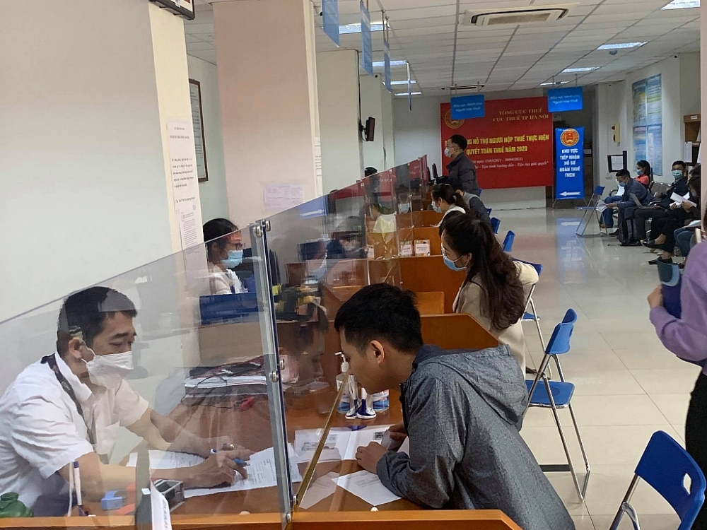 Năm 2022, Tổng cục Thuế đặt mục tiêu hoàn thành việc số hóa kết quả giải quyết thủ tục hành chính. Ảnh: Thuỳ Linh.
