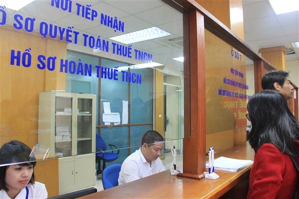 Cần cắt giảm các tài liệu doanh nghiệp phải nộp cho cơ quan Thuế khi thực hiện khai quyết toán thuế Thu nhập doanh nghiệp. Ảnh: T.L.